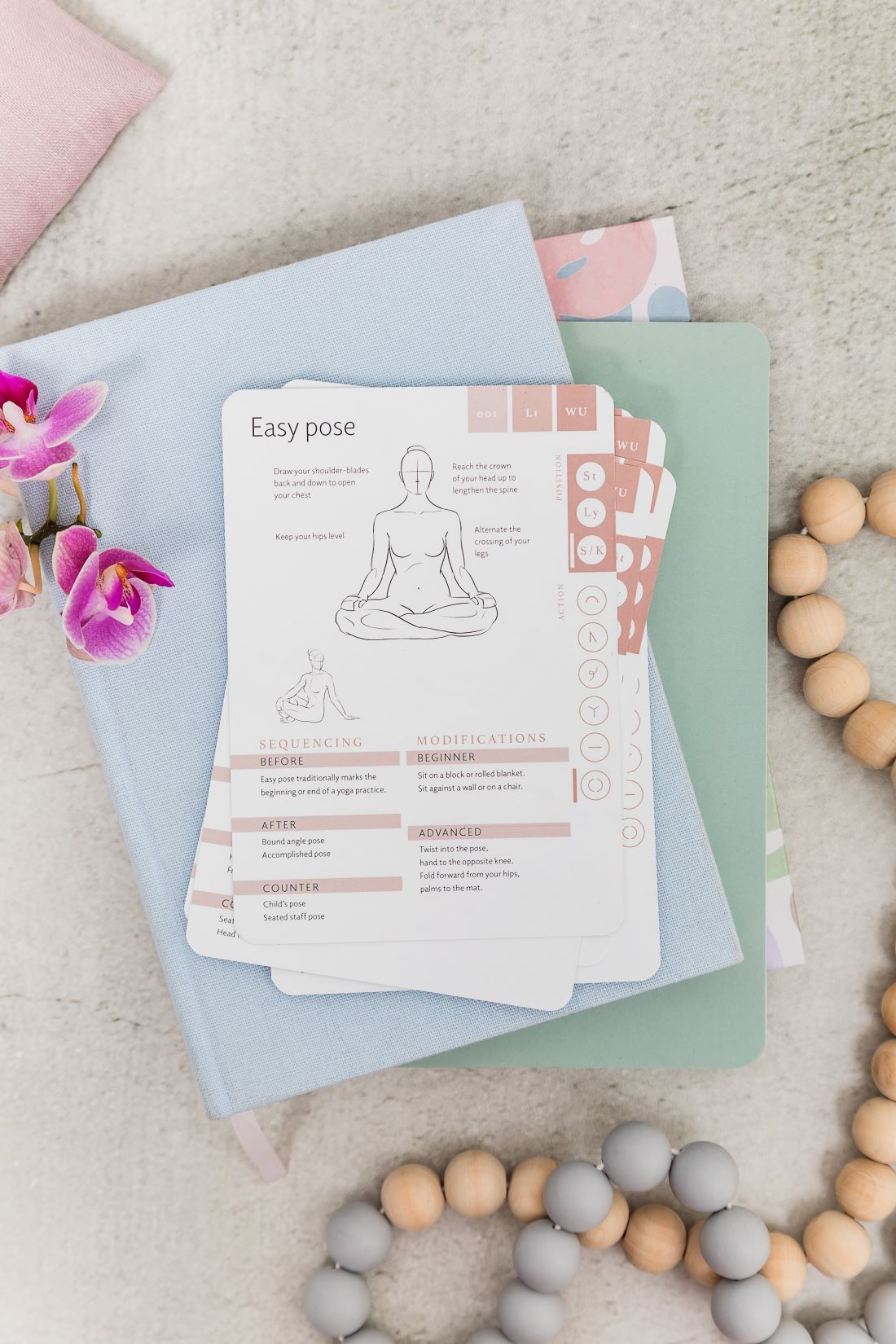 Yoga cards stacked showing easy pose illustration and instructions