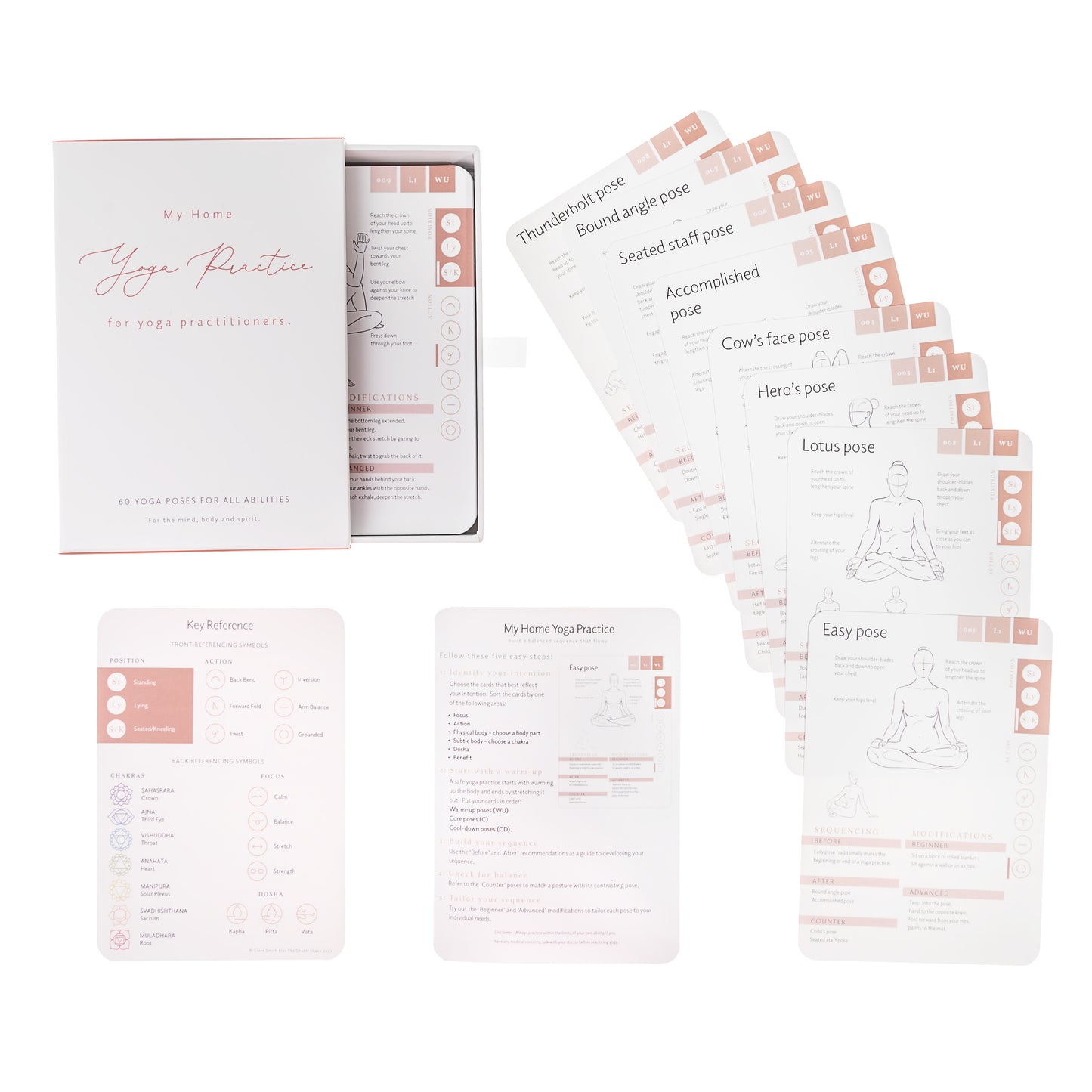 Yoga flashcards in a box and others fanned to reveal illustrated yoga poses and instructions