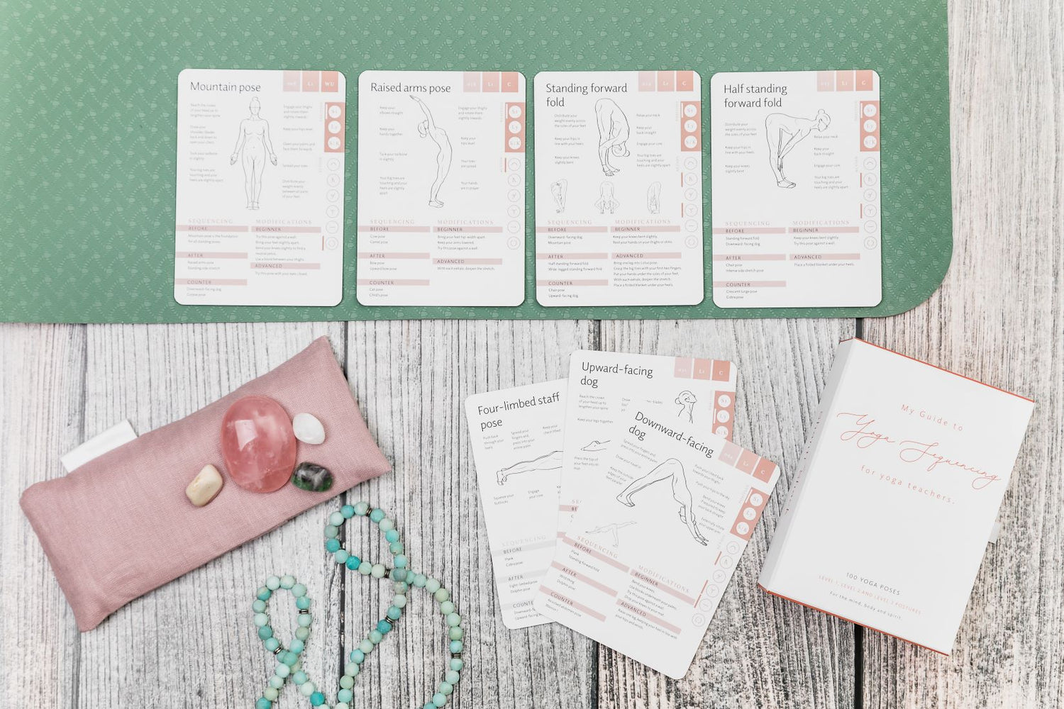 Yoga pose cards laid out on yoga mat in a sequence or yoga flow