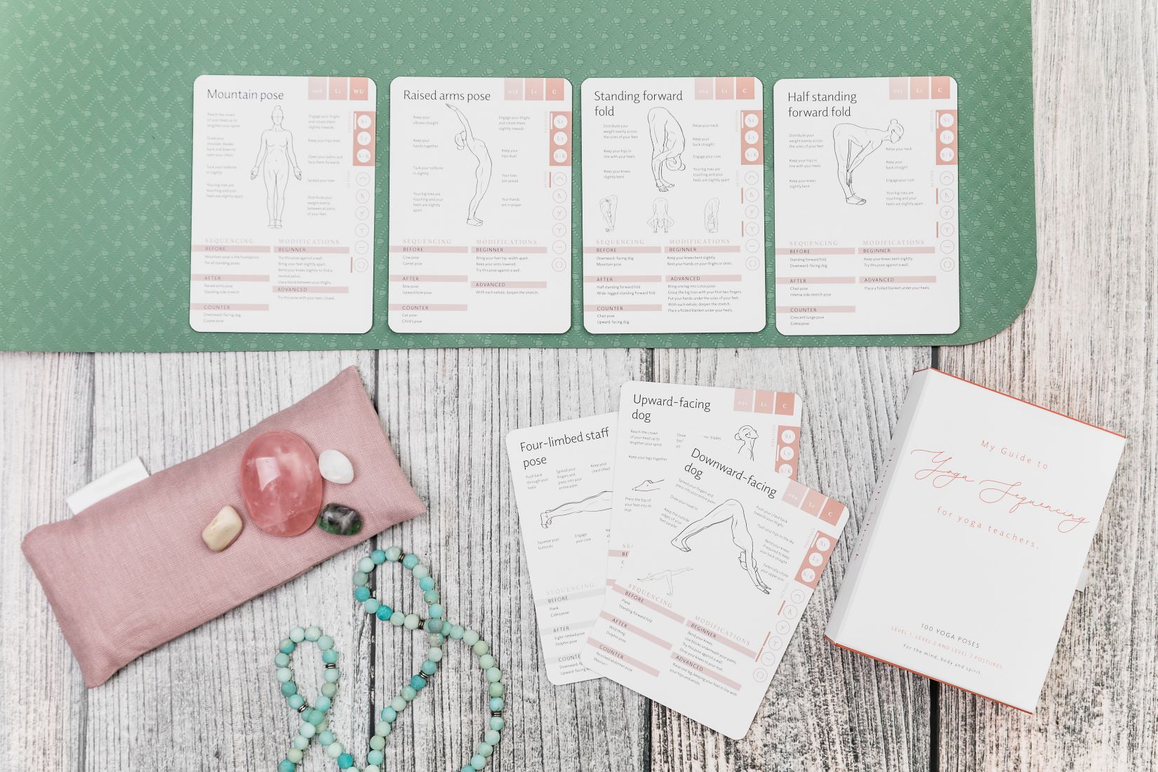 Yoga pose cards laid out on yoga mat in a sequence or yoga flow